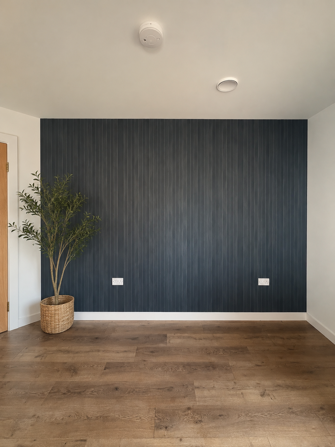 Deep navy panelled feature wall freshly painted by CK Painting